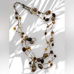 Vintage bronze metallic, amber, brown, & iridescent bone colored glass beads 28”